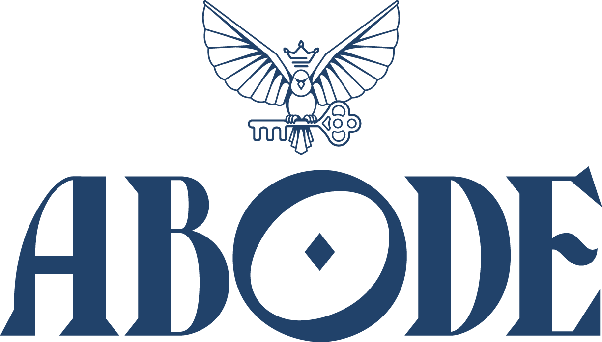 ABODE luxury real estate brokerage logo in blue with outlined eagle holding a key
